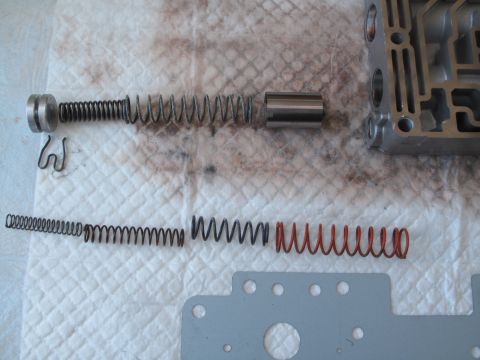 1995 Ford Bronco - Transmission valve body components laid out for service, showing springs and internal parts.
