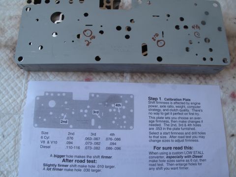 1995 Ford Bronco - Instructions and calibration plate for adjusting transmission shift firmness, with no visible vehicle information.