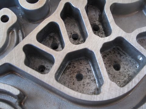 1995 Ford Bronco - This is a close-up view of an engine intake manifold, showing its internal structure and ports.