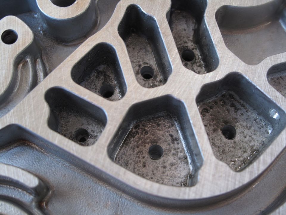 Close-up of an engine intake manifold with multiple ports