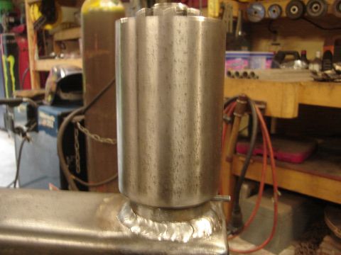 1989 Ford Bronco - Metal part with visible welds, likely in a workshop or garage environment.