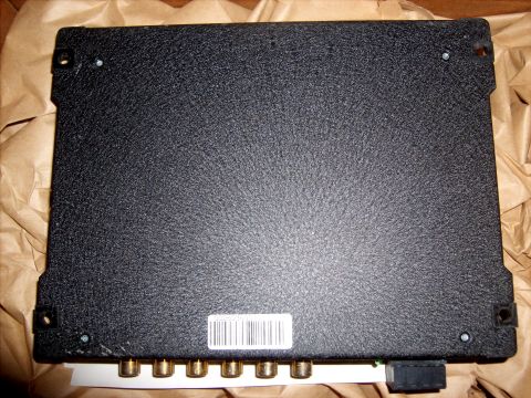 1979 Ford F-250 - This is a close-up of an electronic control unit, likely a component for a vehicle, with visible connectors and a barcode.