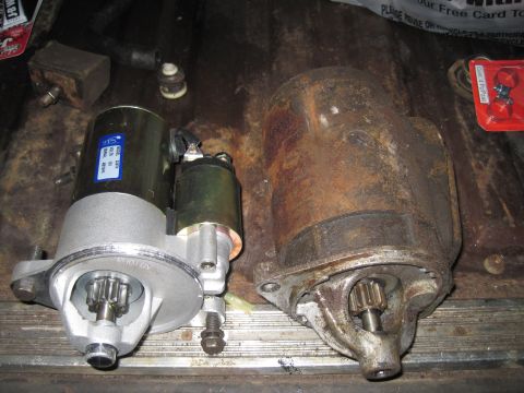 1979 Ford Bronco - Comparison of a new starter motor with a blue label next to a heavily corroded older unit.