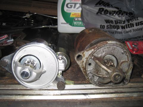 1979 Ford Bronco - A new starter motor is compared to an old, rusted one, with a bottle of Castrol GTX oil and a shopping bag in the background.