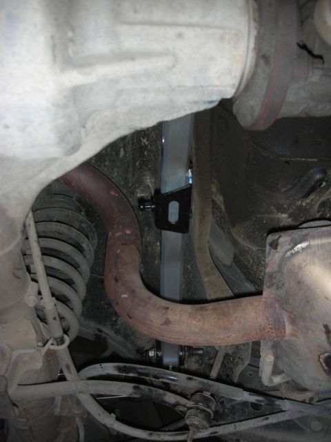 2004 Ford Crown Victoria - A Metco Watts link is installed on the rear suspension of a vehicle, visible alongside the exhaust system.
