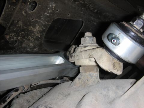 2004 Ford Crown Victoria - Aftermarket suspension part installation, focusing on the hardware and mounting points.