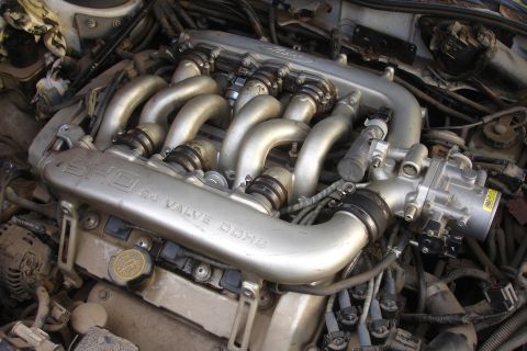 1990 Ford Taurus - Close-up of a Ford SHO 3.0L V6 engine, showing the intake manifold and other components.