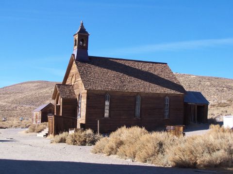 1990 Ford Bronco - Historic wooden church building in Bodie, California, a preserved ghost town.