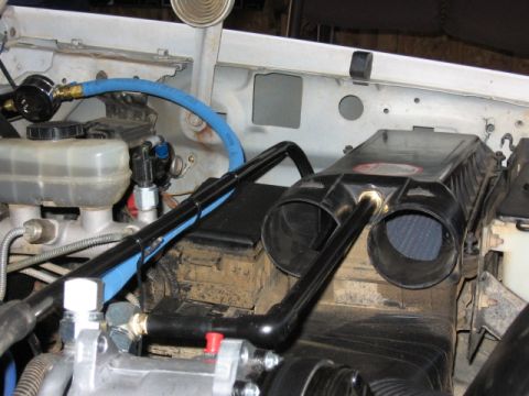 1995 Ford Bronco - Custom air intake system installed in engine bay, with visible plumbing and gauge.