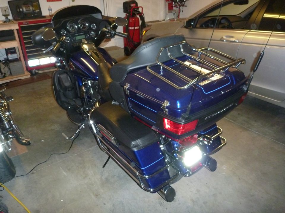 2007 Harley-Davidson Electra Glide Clsc parked in a garage next to a car