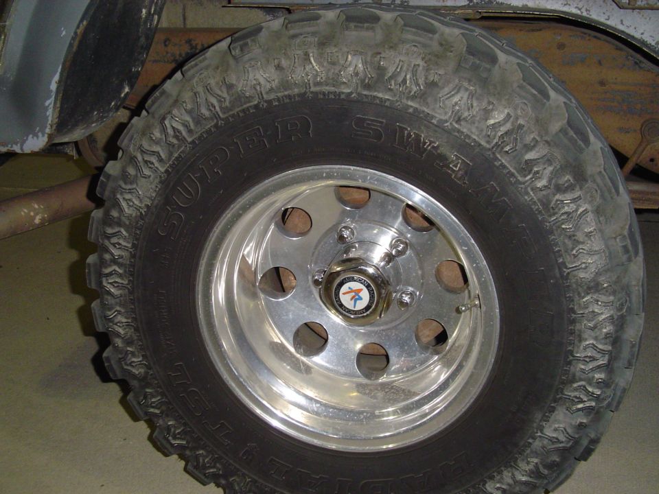 Close-up of a Super Swamper tire on a chrome wheel