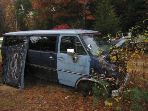 1991 Ford LTD Crown Victoria - This van appears to be in disrepair, with its hood open and a door removed.