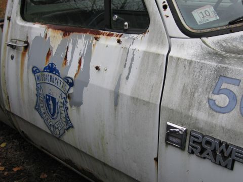 1991 Ford LTD Crown Victoria - This weathered truck displays the Massachusetts Department of Correction emblem and a large number '50' on its side.