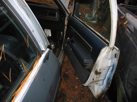 1991 Ford LTD Crown Victoria - Junkyard find: interior of a 1991 Ford Crown Victoria LTD, doors open, showing the dash and door panel.