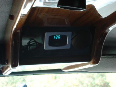 1992 Ford C-350 (Centurion Conversions) - Digital gauge displaying '126' is mounted in wood trim inside a vehicle's interior.