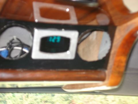 1992 Ford C-350 (Centurion Conversions) - A digital display and gauges are visible on the dashboard of a vehicle.