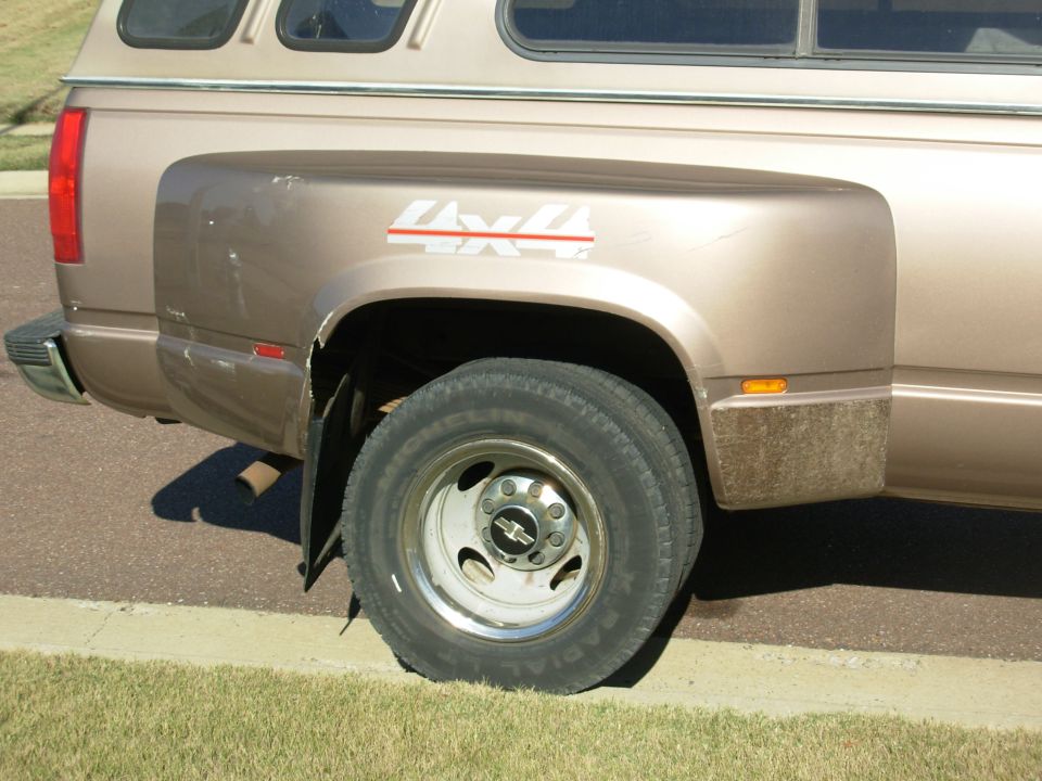 The cracks in the fiberglass wheelwells are very minor, and don't shake or rattle.

SOLD
1997 Chevy K3500 Silverado 205Kmi 4WD 1-ton dually

E-mail me thru my profile here or search CraigsList Memphis.
NEVER WRECKED - NO MAJOR REPAIRS
Most service was done at the dealership.
- 6.5L TurboDiesel (no smoke/leaks/rattles/squeaks)
- 4L80-E
- 4.10 PosiTrac
- Light Autumnwood (camper matches)
- tilt cruise cassette PW/PL/PM/RKE
- leather steering wheel & shifter
- autodimming compass RV mirror
- single 34 gal tank
- new Curt Class V hitch receiver 
- factory skid plates (no scars)
- 7 Michelin X-Radials LT225/75R16
- 2 new batteries 2012 with stainless studded terminals

New Dorman LLT FSD 2013
Reman HydroBoost 2012
New injection pump 2010
New drivebelt 2010
New driver's inside door handle 2012
Trans flush 2010
New rear brake cylinders & shoes, axle seals 2010
New A/C compressor
New master cylinder 2009
New vacuum pump 2005
Ball joints & pitman arm 2004
