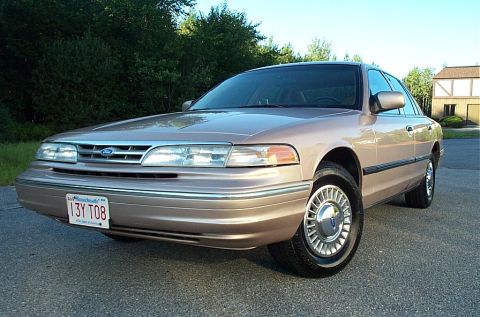 2001 Ford Crown Victoria - Tan 2001 Ford Crown Victoria with Massachusetts license plate 13Y T08.