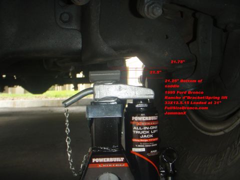 1995 Ford Bronco - A 1995 Ford Bronco's undercarriage is shown with a Powerbuilt All-In-One Truck Lift Jack.