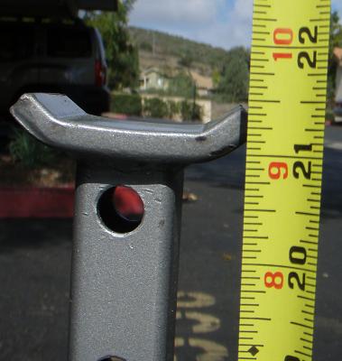 1995 Ford Bronco - A jack stand is measured with a tape measure, with an SUV visible in the background.