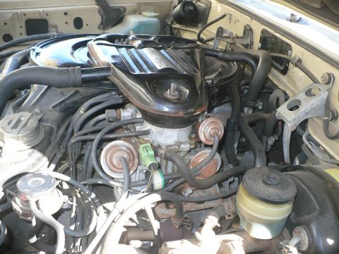 1986 Toyota Land Cruiser - Close-up view of an engine bay, showing various components and hoses.