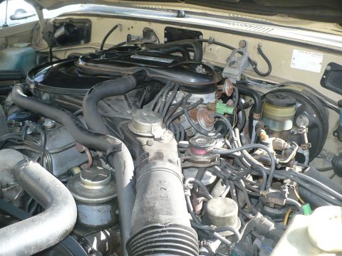 1986 Toyota Land Cruiser - Engine bay of a 1986 Toyota Land Cruiser, showing the V6 engine and associated components.