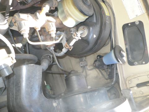 1986 Toyota Land Cruiser - Close-up of the brake master cylinder and booster on a 1986 Toyota Land Cruiser.
