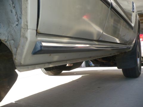 1986 Toyota Land Cruiser - The underside of a vehicle is visible, with a focus on the side panel and wheel area.