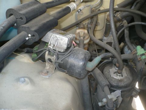 1986 Toyota Land Cruiser - Close-up view of engine compartment hoses and electrical components.