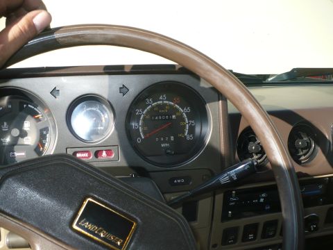 1986 Toyota Land Cruiser - The dashboard of a Toyota Land Cruiser shows the speedometer, tachometer, and other interior controls.