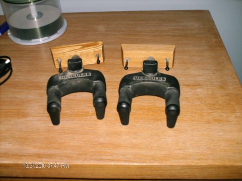 1996 Ford F-150 - Two Hercules guitar stands are shown on a wooden table surface.