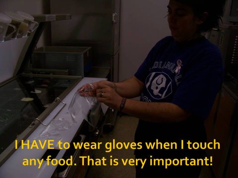 1989 Ford Bronco - A person prepares to handle food while wearing gloves, emphasizing the importance of hygiene.