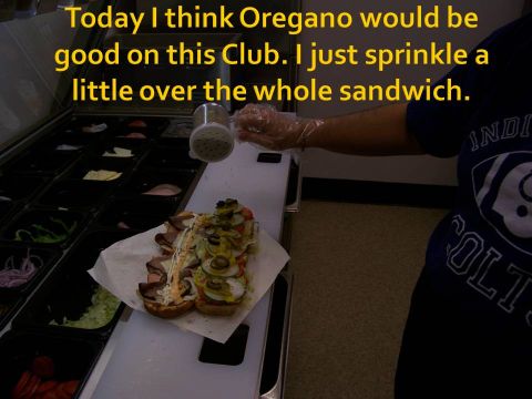 1989 Ford Bronco - A sandwich is being seasoned with oregano, with salad bar ingredients visible in the background.
