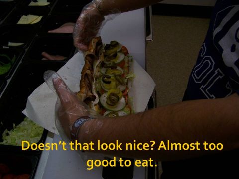 1989 Ford Bronco - A sandwich is being prepared with various toppings, looking almost too good to eat.