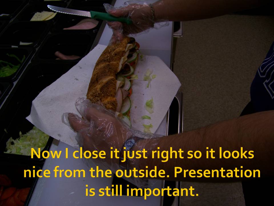 Sandwich being closed with a knife, text overlay