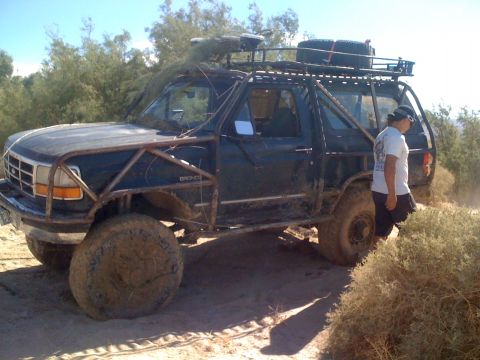 1989 Ford Bronco - This modified Ford Bronco is equipped for off-road adventures, a custom roll cage and roof rack.