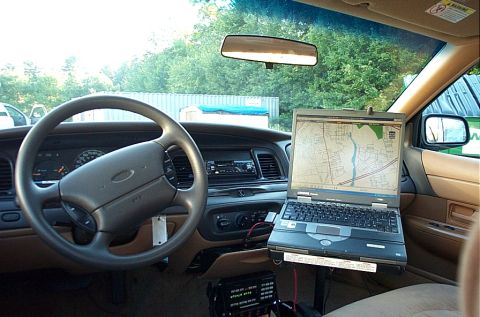 2001 Ford Crown Victoria - The interior of a 2001 Ford Crown Victoria police car is equipped with a laptop displaying a GPS map.