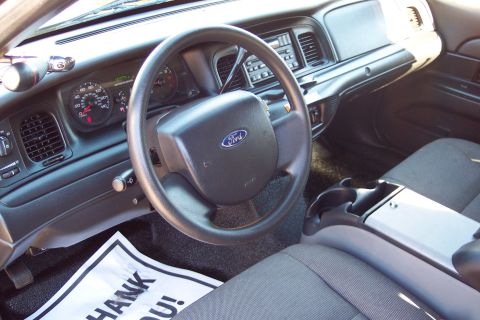 2001 Ford Crown Victoria - The interior of a 2001 Ford Crown Victoria, a floor mat with 'Thank You!' text.