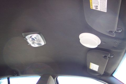 2001 Ford Crown Victoria - Interior view of a vehicle's ceiling, showing lighting and sun visors.