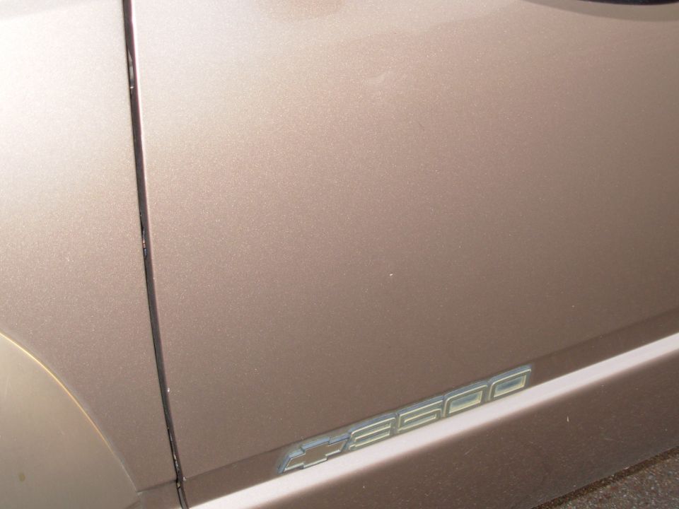 That tiny white speck near the center of the pic used to be a shallow ding.  After a trip to the dent doctor, it's barely noticeable.

SOLD
1997 Chevy K3500 Silverado 205Kmi 4WD 1-ton dually

E-mail me thru my profile here or search CraigsList Memphis.
NEVER WRECKED - NO MAJOR REPAIRS
Most service was done at the dealership.
- 6.5L TurboDiesel (no smoke/leaks/rattles/squeaks)
- 4L80-E
- 4.10 PosiTrac
- Light Autumnwood (camper matches)
- tilt cruise cassette PW/PL/PM/RKE
- leather steering wheel & shifter
- autodimming compass RV mirror
- single 34 gal tank
- new Curt Class V hitch receiver 
- factory skid plates (no scars)
- 7 Michelin X-Radials LT225/75R16
- 2 new batteries 2012 with stainless studded terminals

New Dorman LLT FSD 2013
Reman HydroBoost 2012
New injection pump 2010
New drivebelt 2010
New driver's inside door handle 2012
Trans flush 2010
New rear brake cylinders & shoes, axle seals 2010
New A/C compressor
New master cylinder 2009
New vacuum pump 2005
Ball joints & pitman arm 2004
