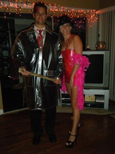 1990 Ford Probe - Two people dressed in costumes pose for a photo, with one person holding a prop weapon.