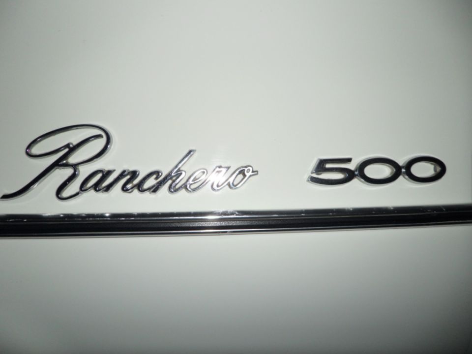 Chrome Ranchero 500 emblem on a white surface, with a thin chrome trim strip below
