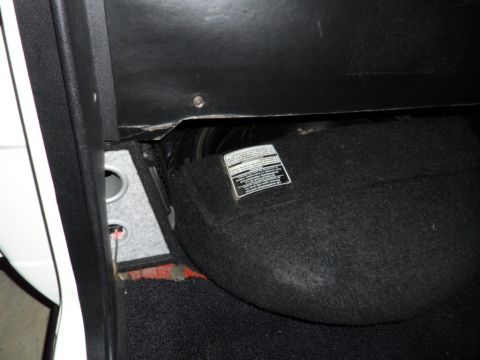 1973 Ford Ranchero - A sticker with text is visible on the carpeted panel inside the vehicle's interior.