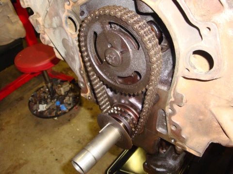 1989 Ford Bronco - Close-up view of the engine's timing chain and gears, likely during maintenance or repair.