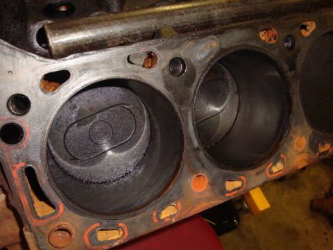 1989 Ford Bronco - Close-up view of engine block cylinders, showing carbon deposits and wear.