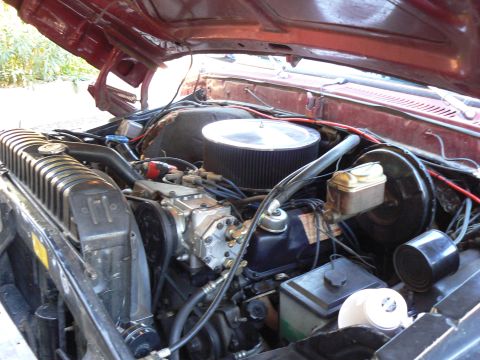 1978 Ford Bronco - Close-up view of the engine compartment, highlighting the V8 engine and associated components.
