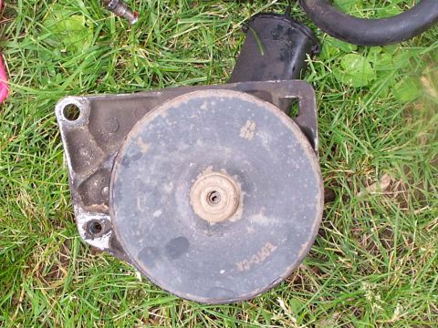 1986 Ford Bronco - Stock Pump with it's bracket. bolt holes are 3-3/8" apart.