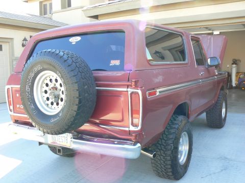 1978 Ford Bronco - Rear three-quarter view of a maroon 1978 Ford Bronco parked in a garage.