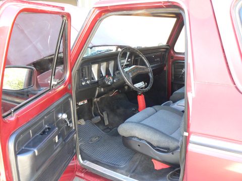 1978 Ford Bronco - Interior view of a 1978 Ford Bronco, showing the dashboard, steering wheel, and seats.