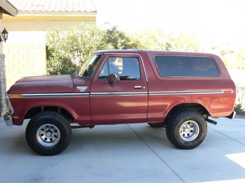 1978 Ford Bronco - Maroon 1978 Ford Bronco with chrome trim and aftermarket wheels.